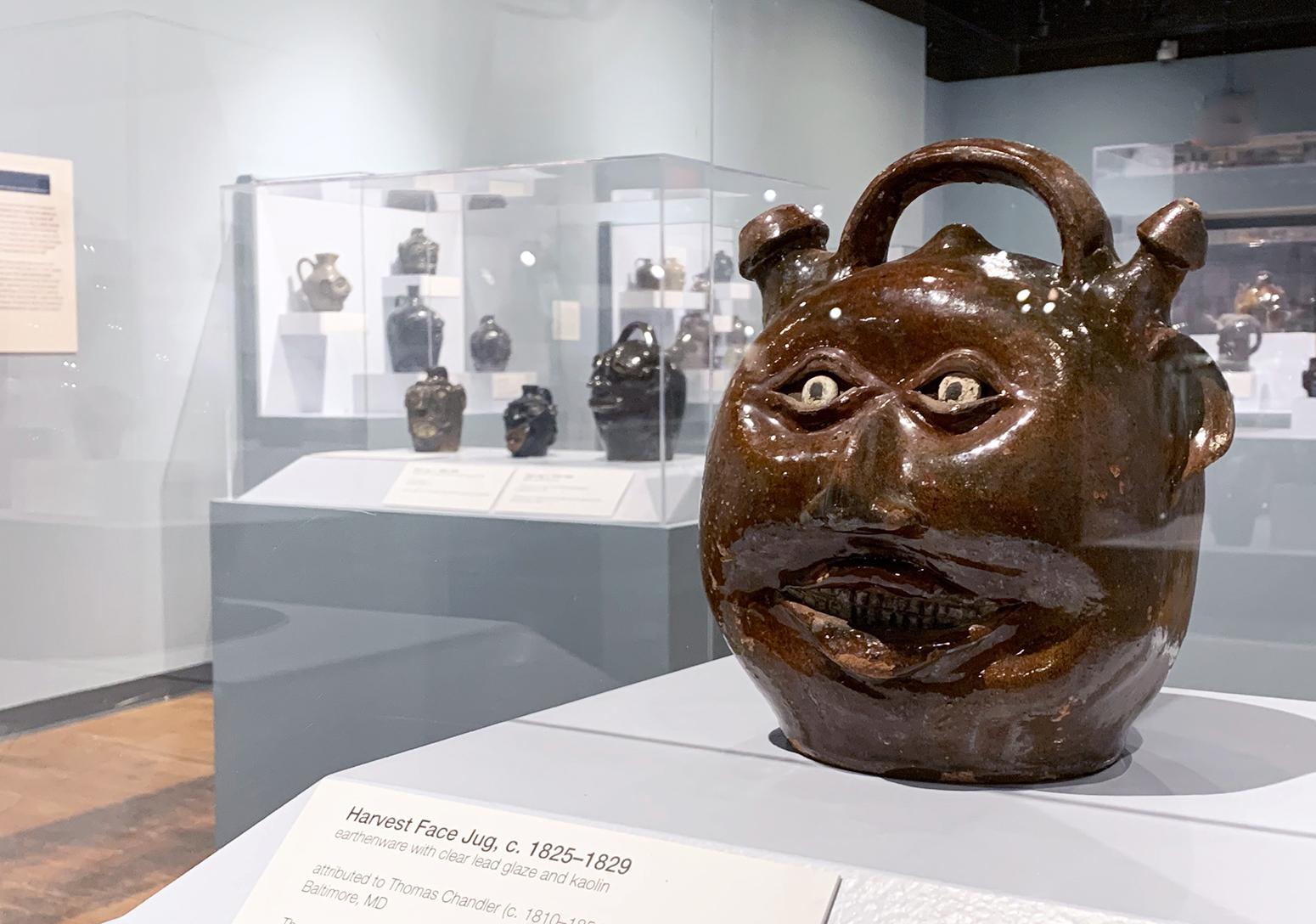 A jug with eyes, nose and mouth.