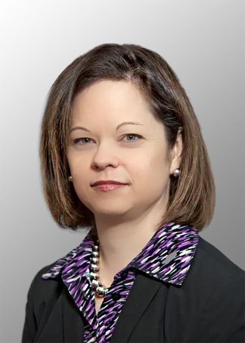 Head shot of a female with brown chin length hair wearing a purple shirt and black suit coat
