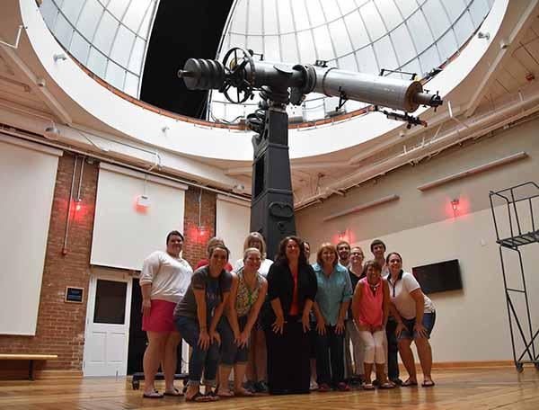 Teachers from across South Carolina pose with the Boeing Observatory’s 1926 Alvan Clark telescope.